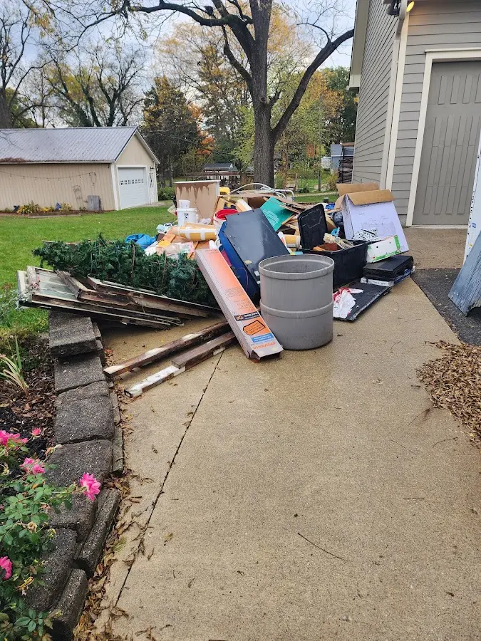 Dumpster being loaded with debris for Demolition Dumpster Rental in Moses Lake North